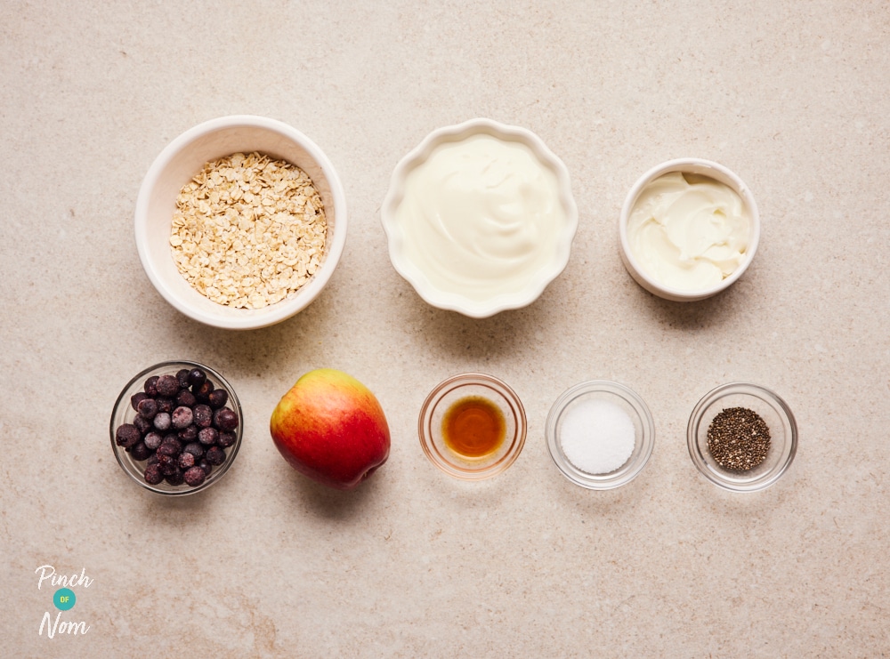 Apple and blackcurrant oats ingredients laid out on a counter.