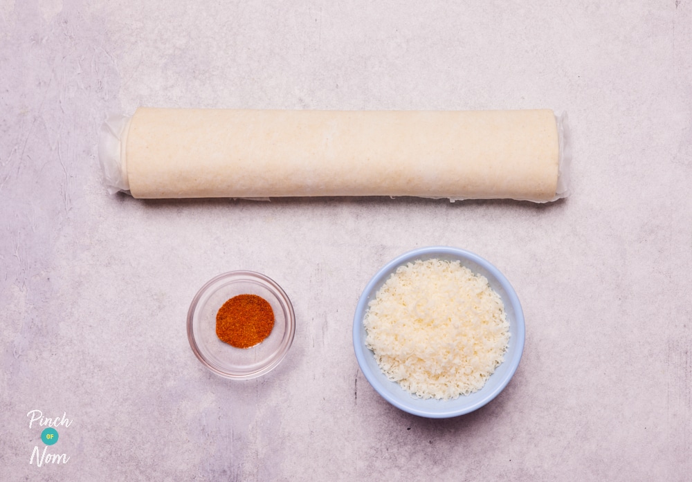 The raw ingredients for Pinch of Nom's Cheese Palmiers are laid out on a kitchen counter, ready to begin baking.