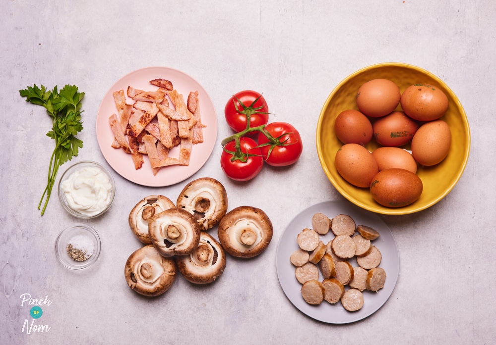 The raw ingredients for Pinch of Nom's slimming-friendly Breakfast Quiche are laid out on a kitchen counter, ready to begin cooking.