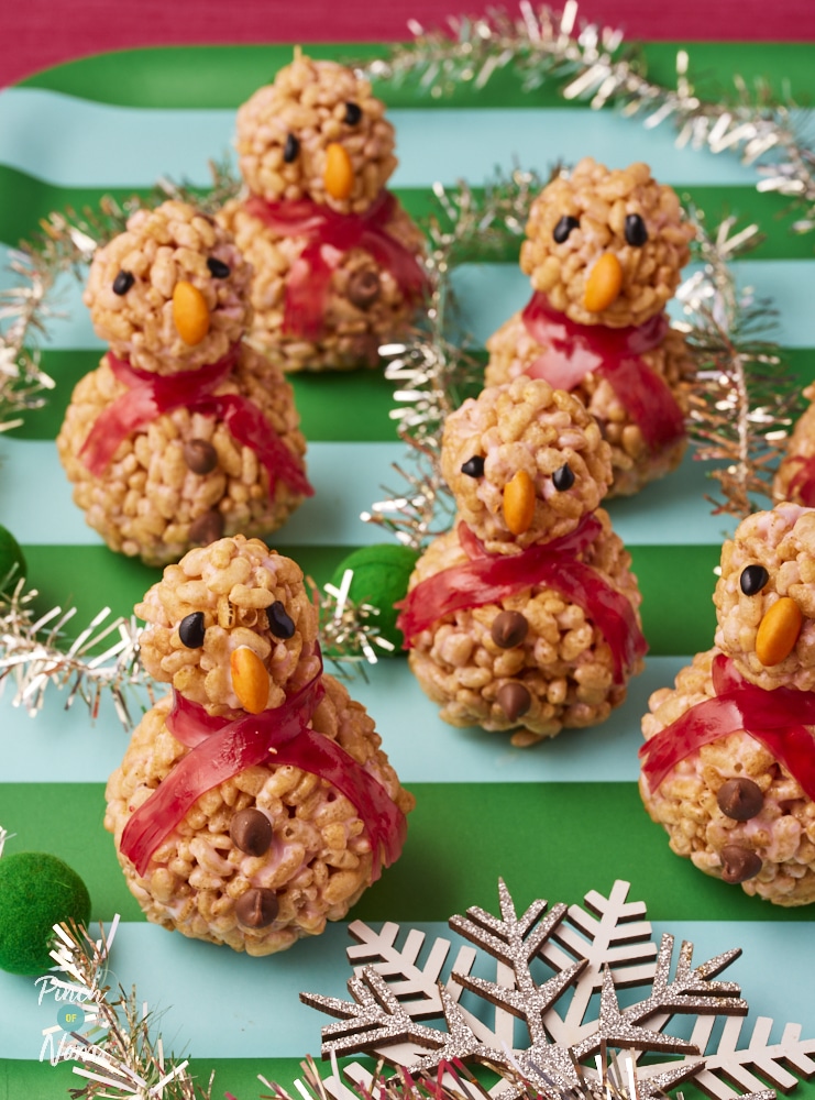 Pinch of Nom Rice Krispie Marshmallow Snowmen, decorated and ready for serving.