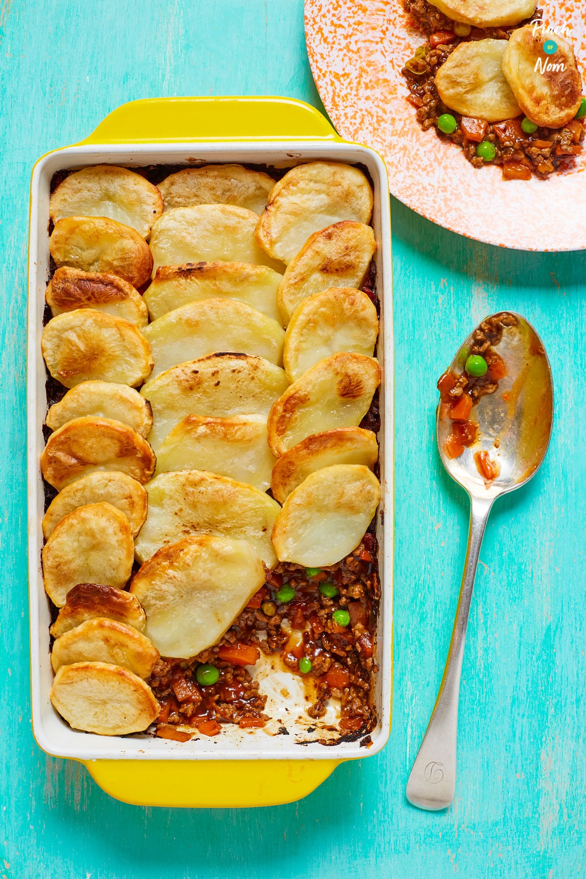 An oven dish is filled with a freshly-baked batch of Pinch of Nom's slimming-friendly Minced Beef Hotpot.