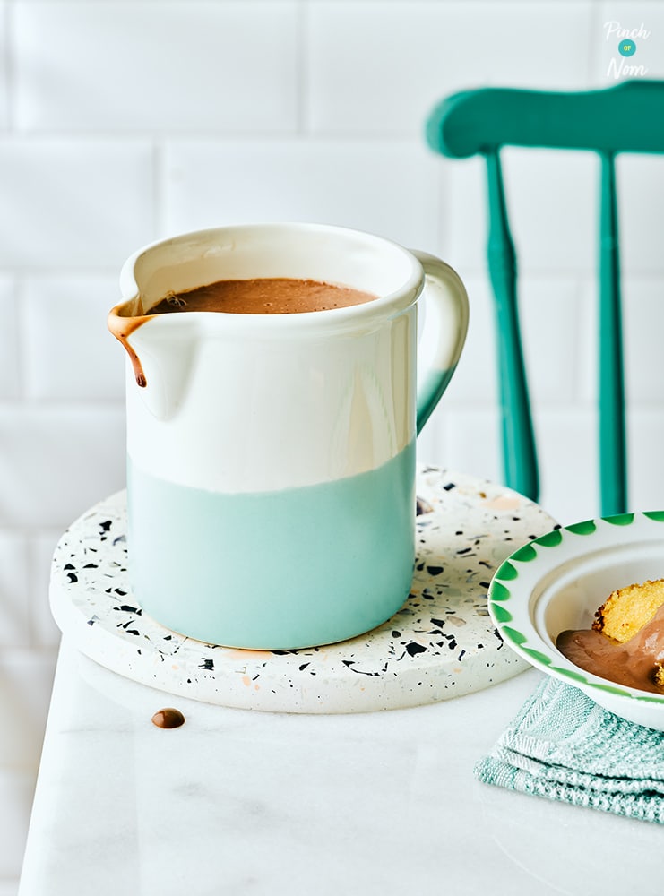 A jug is filled with Pinch of Nom's slimming-friendly Chocolate Custard from the Comfort Food cookbook.