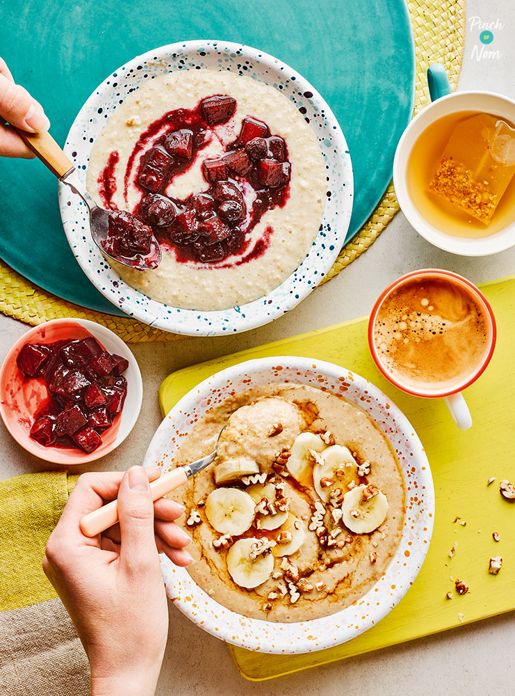 Pinch of Nom's Slow-Cooker Oats with Two Toppings from the Comfort Food cookbook are served in two bowls. One is topped with a berry compote and the other is topped with bananas, pecans and maple syrup.
