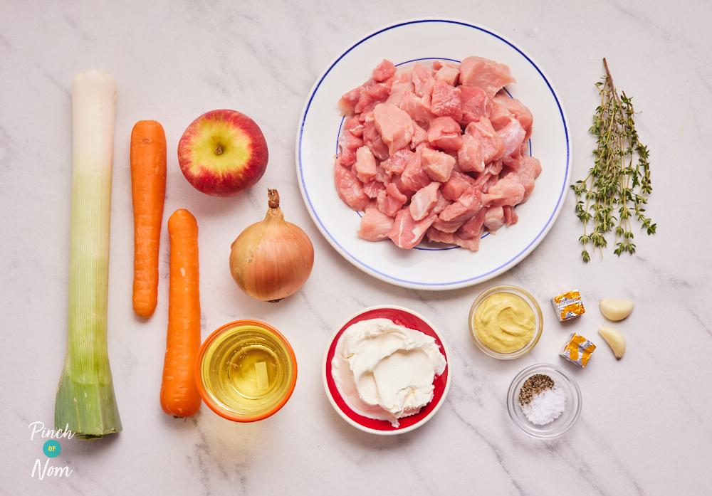 The uncooked ingredients for Pinch of Nom's Somerset Pork are laid out on a worktop.