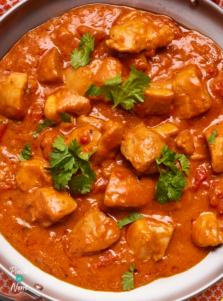 A close-up of Pinch of Nom's Spicy Coconut and Lime Chicken Curry with coriander sprinkled on top.