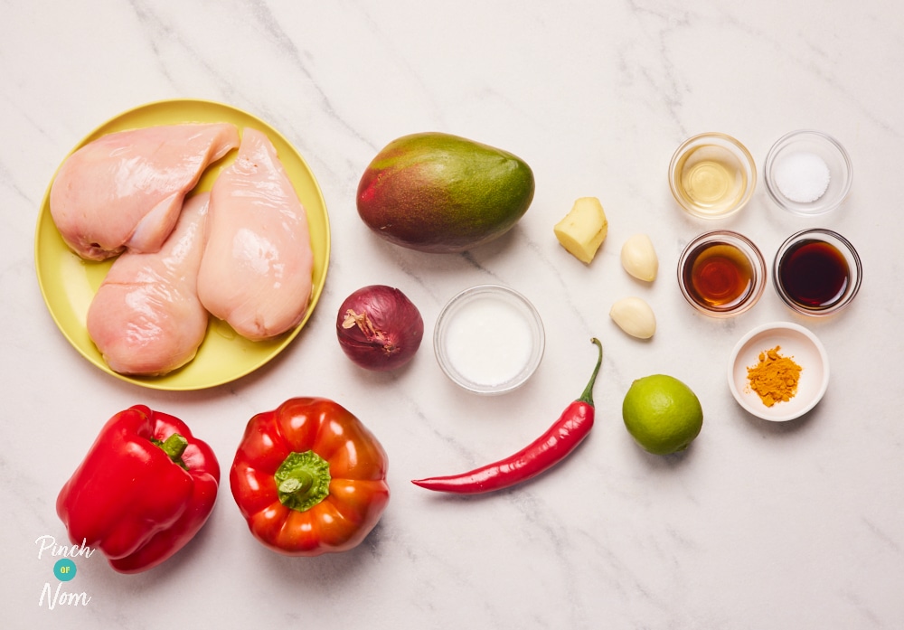 The ingredients for Pinch of Nom's Mango Chilli Chicken are laid out on a kitchen surface, ready to begin cooking.