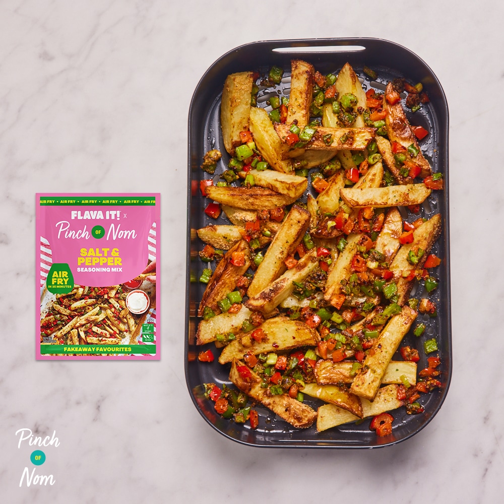Pinch of Nom's slimming-friendly Flava It! Salt and Pepper Chips are served in an air fryer basket, with a pink recipe mix sachet to one side.