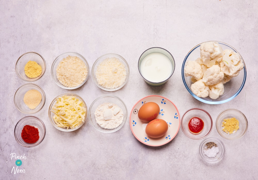 The ingredients for Pinch of Nom's Air Fryer Cauliflower Cheese Dippers are laid out on a kitchen counter, ready to begin cooking.