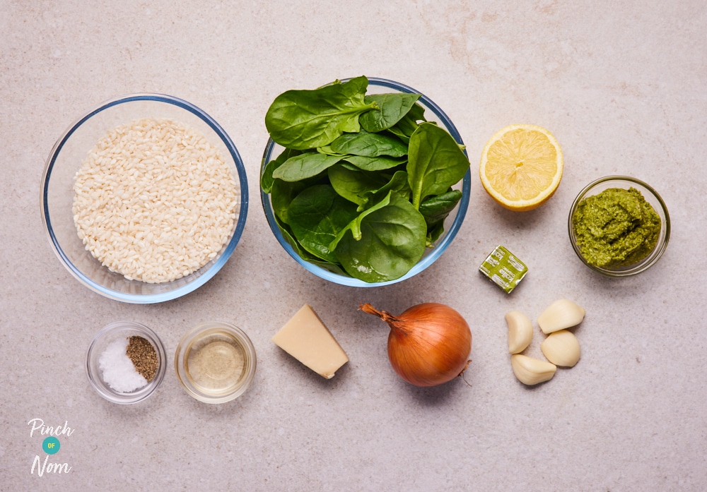 The raw ingredients for Pinch of Nom's slimming-friendly Parmesan and Spinach Risotto are laid out on a kitchen counter, ready to begin cooking.