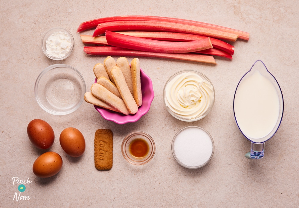 The ingredients for Pinch of Nom's slimming-friendly Rhubarb and Custard Trifles are laid out on a kitchen counter, ready to begin cooking.