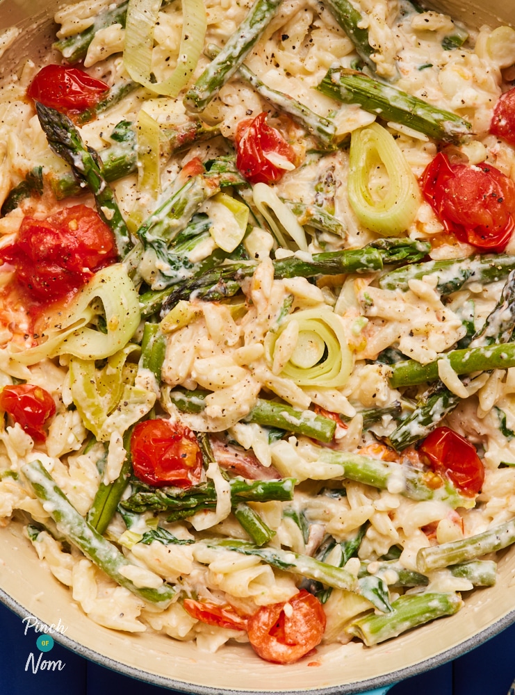 A large oven dish is filled with a freshly-baked batch of Pinch of Nom's slimming-friendly Baked Feta Orzo.