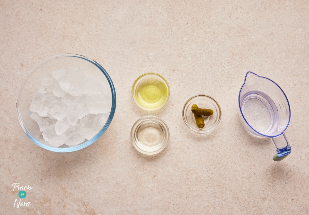 Frozen Pickle Martini ingredients laid out on a table