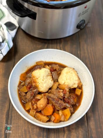 Slow Cooker Beef and Root Vegetable Stew with Cheddar Dumplings pinchofnom.com