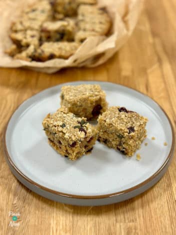 Slow Cooker Coconut and Cranberry Flapjacks pinchofnom.com