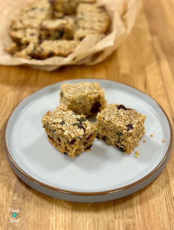 Slow Cooker Coconut and Cranberry Flapjacks pinchofnom.com