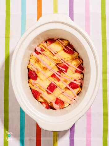 Slow Cooker Strawberry Cheesecake Bread Pudding pinchofnom.com