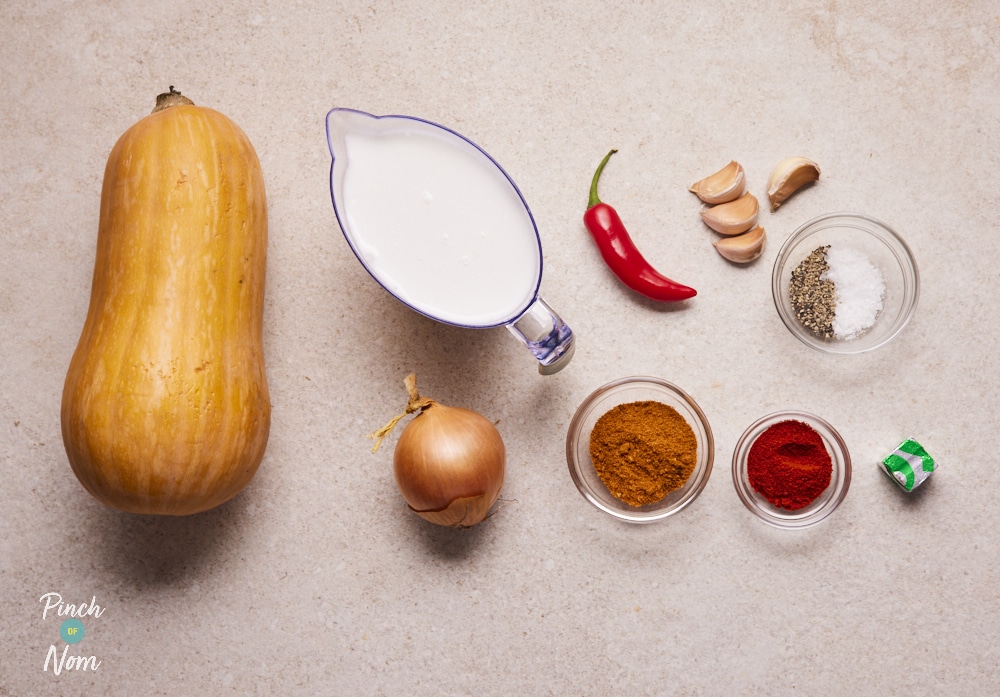 Spiced Pumpkin Soup ingredients laid out on counter.